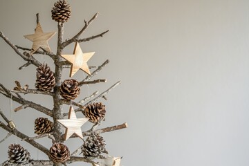 Wall Mural - alternative christmas tree made with natural materials is standing in front of a white wall