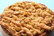 © New Africa - Tasty homemade apple pie on light blue background, closeup