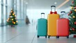 © sunchai - Colorful luggage in a festive airport setting with Christmas tree