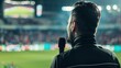 © Jolin - Sports commentator passionately narrating live sports event on television screen, microphone in hand, modern broadcasting studio with clean uncluttered background for copy space.