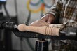 © Kitz Pix - close up of a person using a lathe in workshop