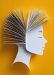 © Georgii - Creative concept with open book forming head silhouette on yellow background symbolizing knowledge and imagination
