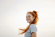 © luismolinero - Portrait of happy young pretty redhead girl over isolated white background