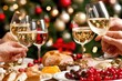 © Konstiantyn Zapylaie - Festive celebration: friends toasting at holiday dinner with wine and gourmet food