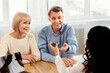 © Prostock-studio - Lung Disease. Female physician giving asthma inhaler to smiling elderly couple, free space