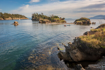 Wall Mural - Aerial View of Kayakers in Ewing Cove, Sucia Island, Washington. Emerald waters and sandstone formations make Sucia Island a must go destination for kayakers worldwide. Located in the Salish Sea area.