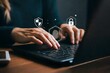 © Henhen - Person typing on a laptop with digital security icons floating above their hands.