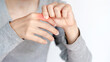 © Oporty786 - person experiencing discomfort in their hand, showing signs of pain