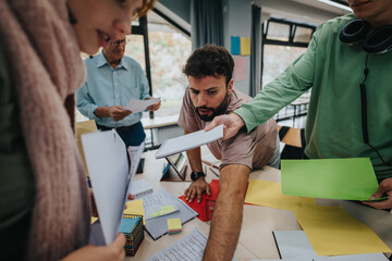 A group of college students work on a project with guidance from an elderly professor in a modern classroom, fostering teamwork and education.