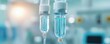 © Jiraporn - Close-up of a medical IV drip with clear fluid, highlighting healthcare and treatment in a clinical environment.