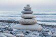 © manusha - Zen stone tower on the beach. Concept of meditation and free thinking for mental health