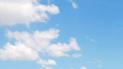 Wall Mural - White clouds on a sunny clear day, Timelapse