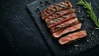 © Generative AI - Grilled sliced beef steak on slate stone table Top view Copy space : Generative AI