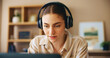© AzeemudDeen/peopleimages.com - Remote work from home, pc and woman with headphones, listening to music and connection. Person, freelancer and entrepreneur with laptop, headset and online reading for project, research and podcast