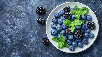 Poster - Fresh blueberry and blackberry berries with mint leaves on a white plate on blue stone background Top view Copy space : Generative AI