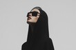 © Papukos - Fashion model posing in black hood and sunglasses looking up