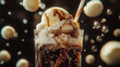 © ABX - Fizzy cola float with ice cream and a straw bubbles