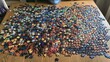 © somsri - Colorful Puzzle Pieces Spread on Wooden Table