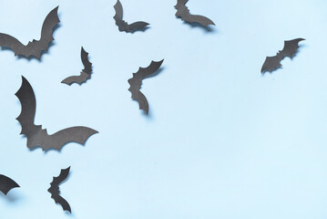 Wall Mural - Paper bats for Halloween party on blue background