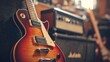 © Copi - Close-up of a red electric guitar with an amp in the background.