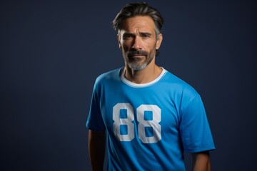 Canvas Print - A man in a blue shirt with the number 88 on it