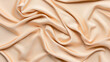 © altitudevisual - Close-up of beige silky fabric with smooth folds and soft texture creating an elegant and luxurious appearance