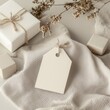 © Alena - Natural gift tag mockup. Blank recrangular favor tag flat lay on table, gift boxes and dried flowers are nearby. Empty gift tag template. Holidays present tag mock up. Boho style background