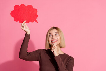 Wall Mural - Photo of pretty cute nice girl wear stylish brown clothes hold card look up empty space isolated on pink color background