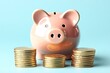 © Keinara Aiko - Saving Money: Piggy Bank and Stacks of Coins on Blue Background, a Simple Visual Guide to Financial Planning