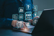 © Antony Weerut - FAQ, frequently asked questions concept. Businessmen answer customer questions online, and Q and A. Online service gives quick answers. asked questions and answers. Q and A. Question mark.