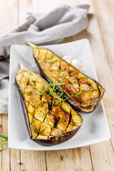 Poster - grilled eggplant with oil and herbs, perfect for healthy meals and Mediterranean cuisine. Ideal for vegetarian and plant-based dishes