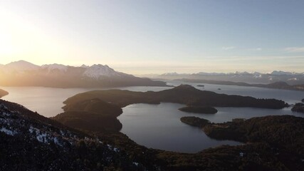 Wall Mural - Drone scenery of Nahuel Huapi Lake with cliffs at sunset in San Carlos de Bariloche, Argentina