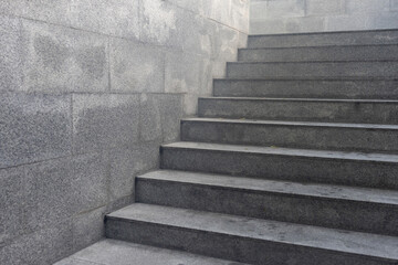 Wall Mural - A gray staircase with a gray wall behind it