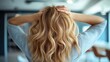 © JoxyAimages - This image features a person with long, flowing blonde hair, with hands resting gently on the top of their head, emphasizing texture and relaxation.