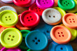 © Ivan Maguire - Close-up of coloured buttons on a wooden background