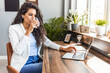 © Dragana Gordic - Professional Woman Working Remotely While Drinking Water at Desk