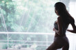 © totojang1977 - portrait shot of sexy beautiful Asian woman wearing white lingerie near window