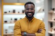 © Aditya - Smiling man showing off a high-tech wearable in a modern boutique, clean solid background, emphasizing innovation and style