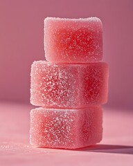 Wall Mural - Three pink gelatin cubes stacked on a pink background.