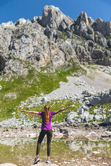 Wall Mural - Female Hiking in Mountains Relaxing during Break