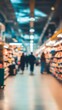© Maria Mikhaylichenko - Blurred supermarket aisle with vibrant shelves and distant shoppers, creating an atmospheric scene of everyday life in a bustling grocery store environment.
