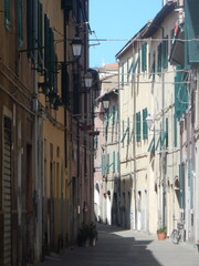 old houses facing a typical street in Piombino, Livorno Province, Tuscany, Italy