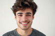 © Patcharaphon - Portrait of happy smart and handsome young man on white background. Studio shot, copy space