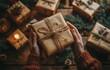 © olegganko - Hands holding a wrapped gift surrounded by holiday decorations and presents in a cozy setting