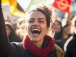 © Bijac - passionate female activist shouting for change, surrounded by a diverse crowd holding banners, conveying energy and determination in a vibrant protest scene, with copy space for messages
