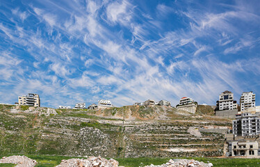 Amman city landmarks-- old roman Citadel Hill, Jordan. Against the background of a beautiful sky with clouds