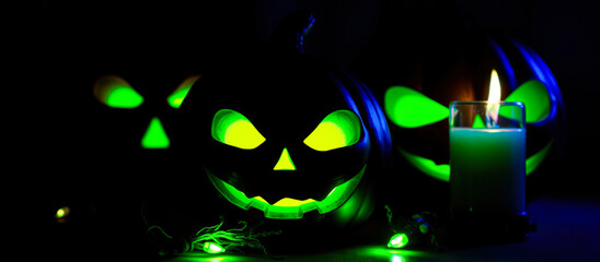 glowing pumpkins a flickering candle create a spooky halloween atmosphere