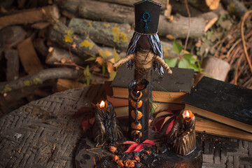 Magic doll for attracting love, rite with voodoo and fate creation, details on a table of witch, occultism concept