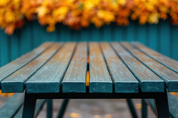 Poster - Empty wooden table presenting autumn colors in a blurred background, ideal for product placement