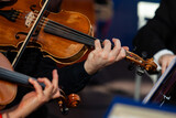  Viola in the hands of a musician in a symphony orchestra